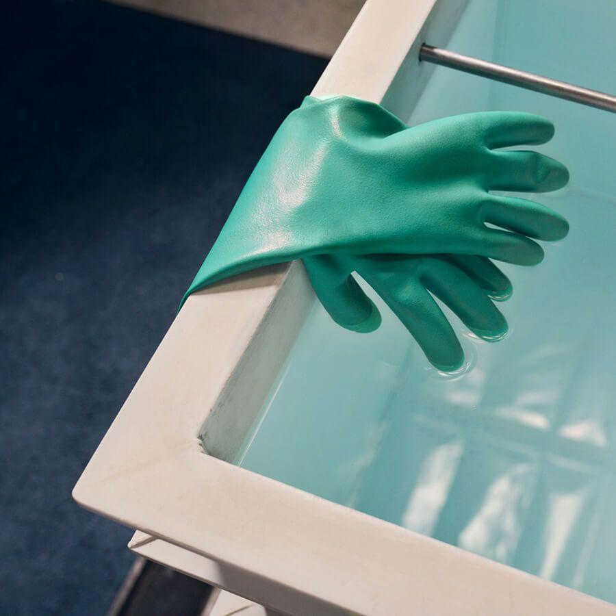 green gloves in clean room setting