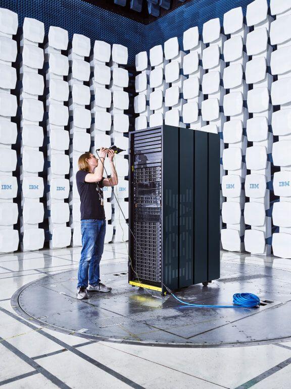 portrait of IBM employee in anechoic test chamber with server
