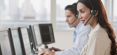 A woman and man working in a call center