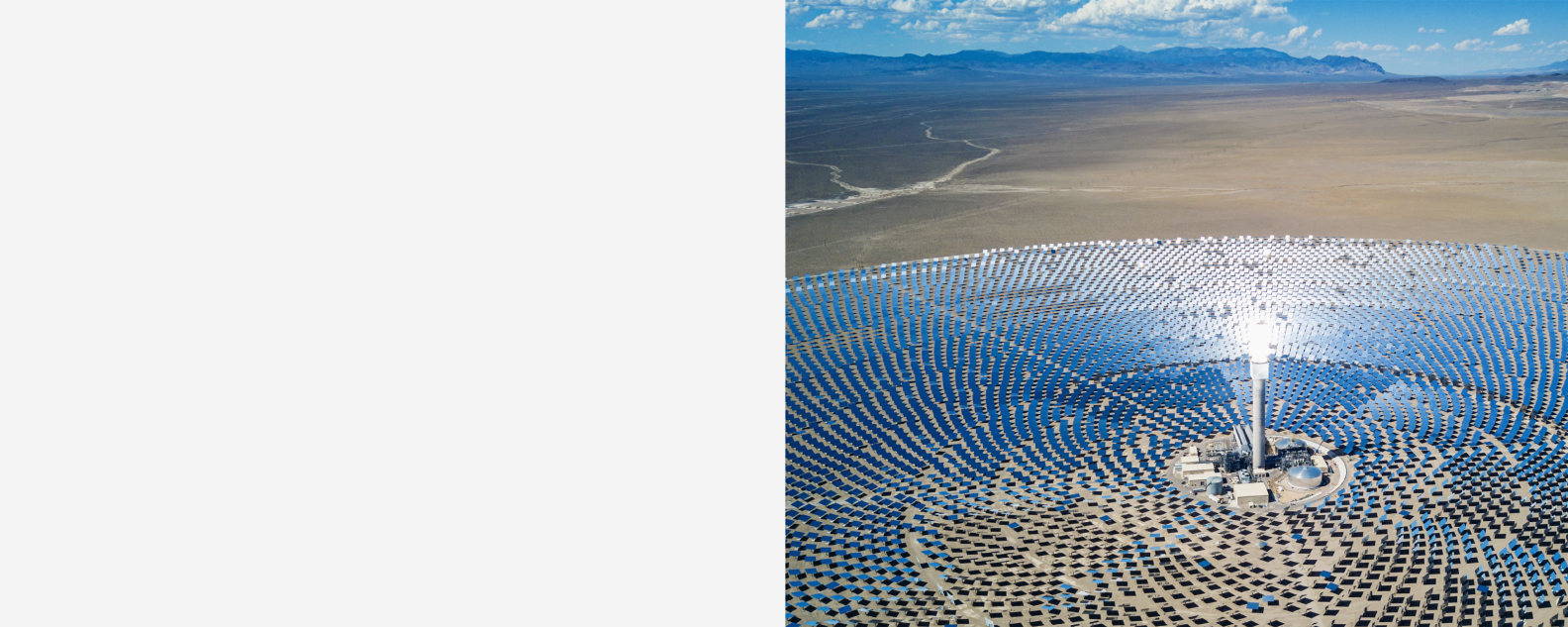 High aerial view of large solar thermal power plant farm in the desert