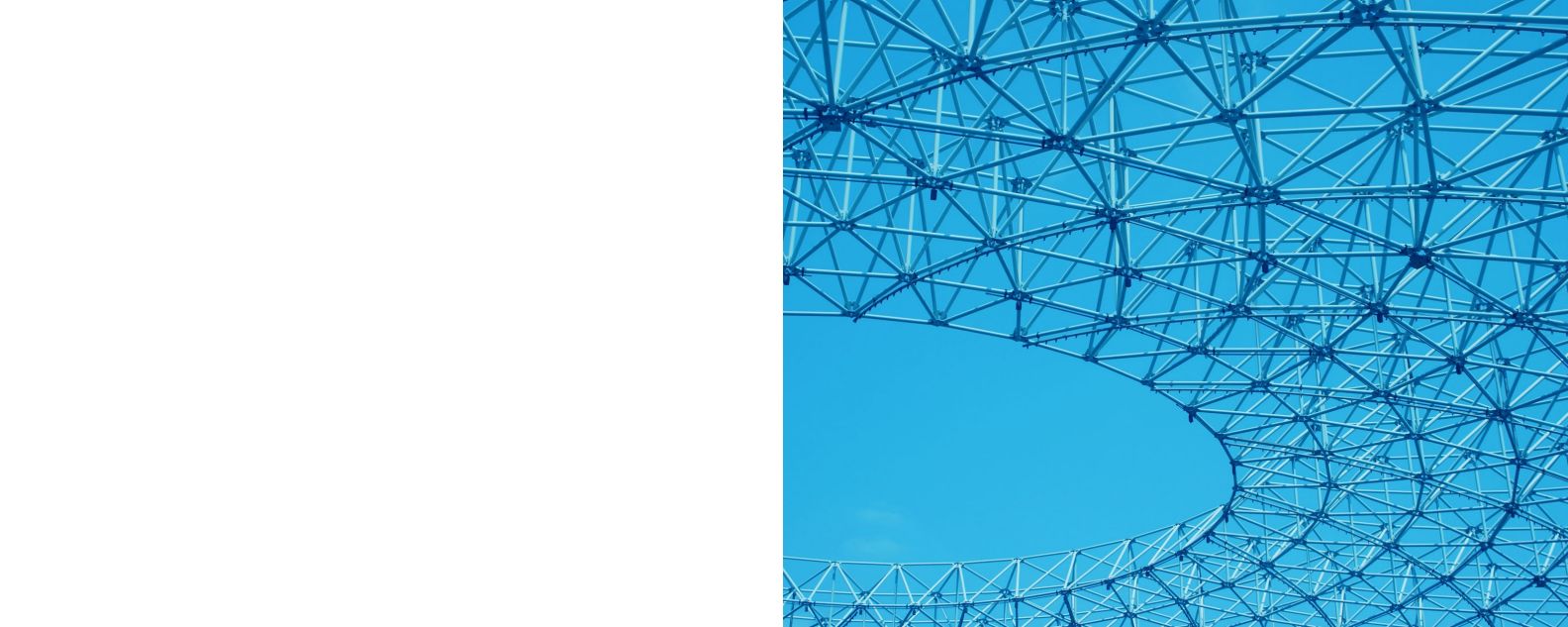 A close up of a spiral metal structure with blue sky in the background