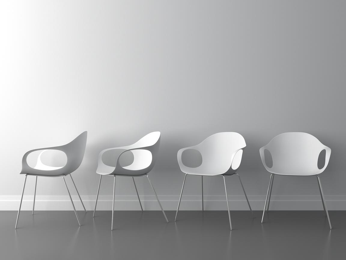 Minimalistic white chairs in bright setting