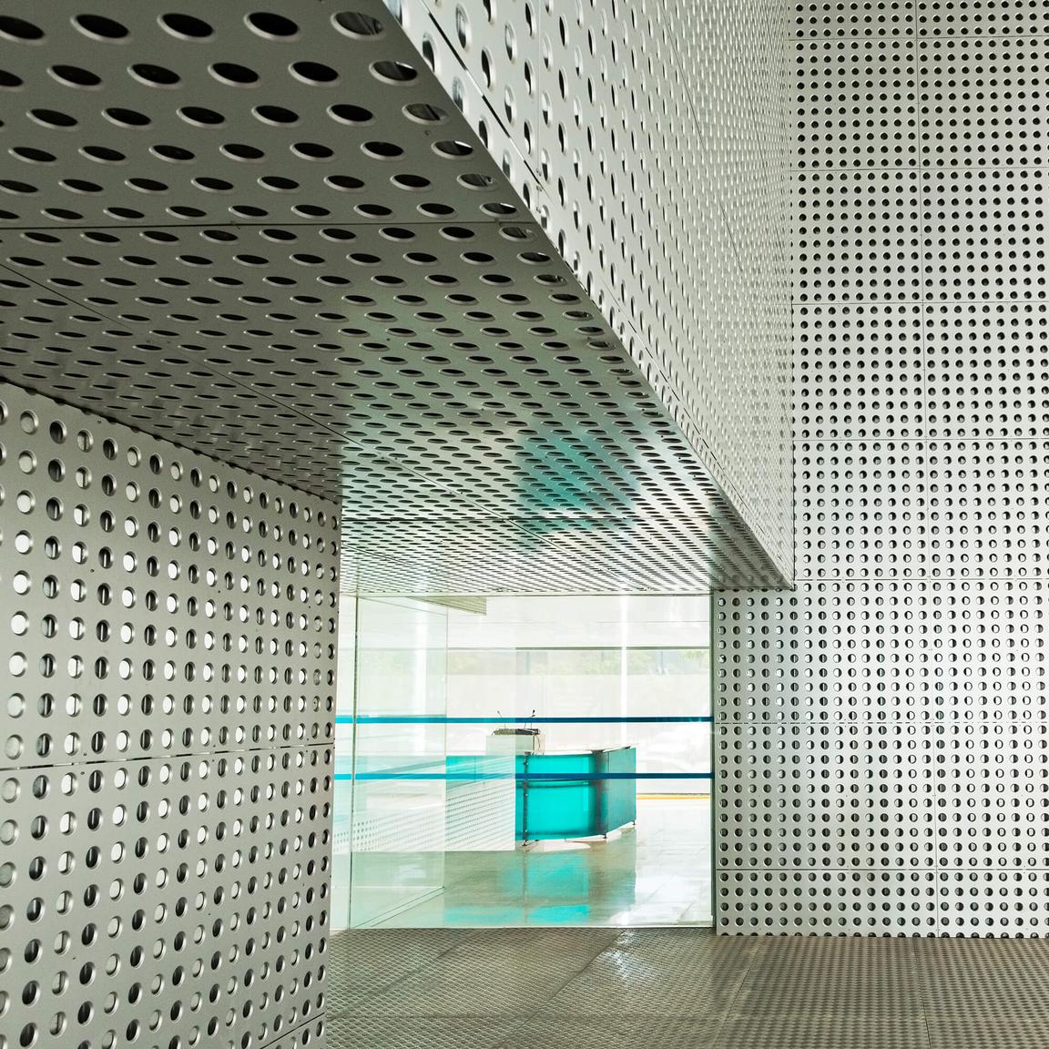 Interior architecture with perforated material