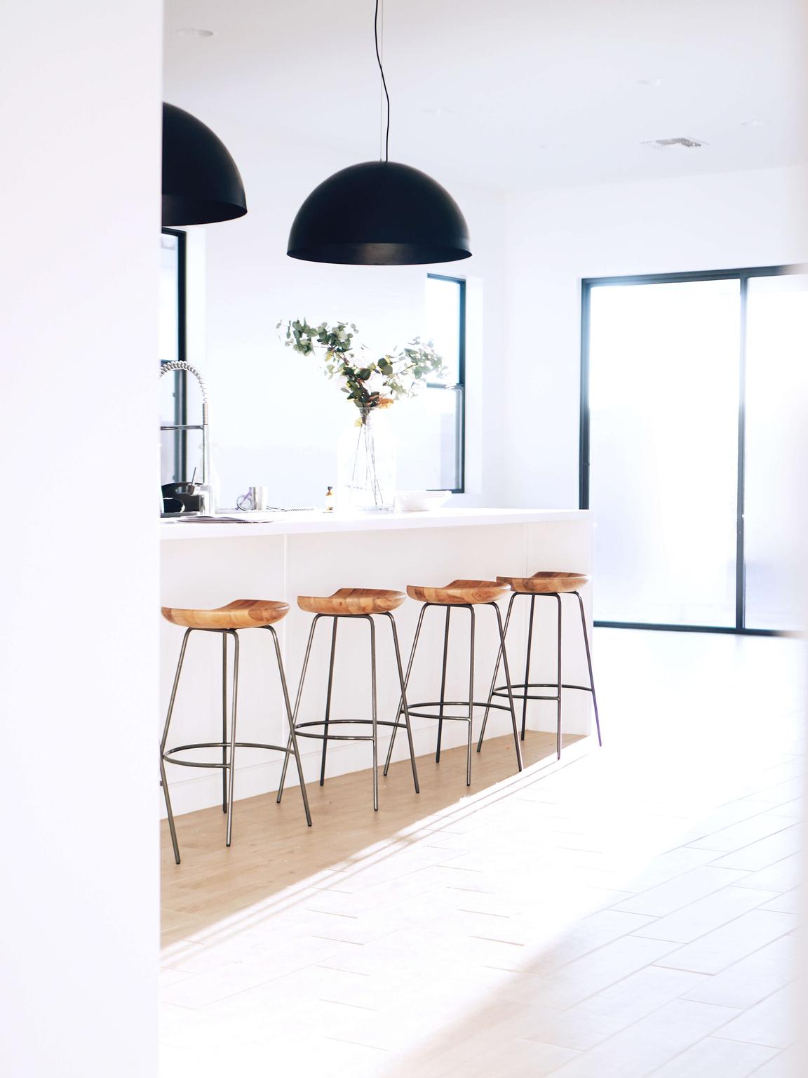 Bright interior with wooden bar charis on a counter