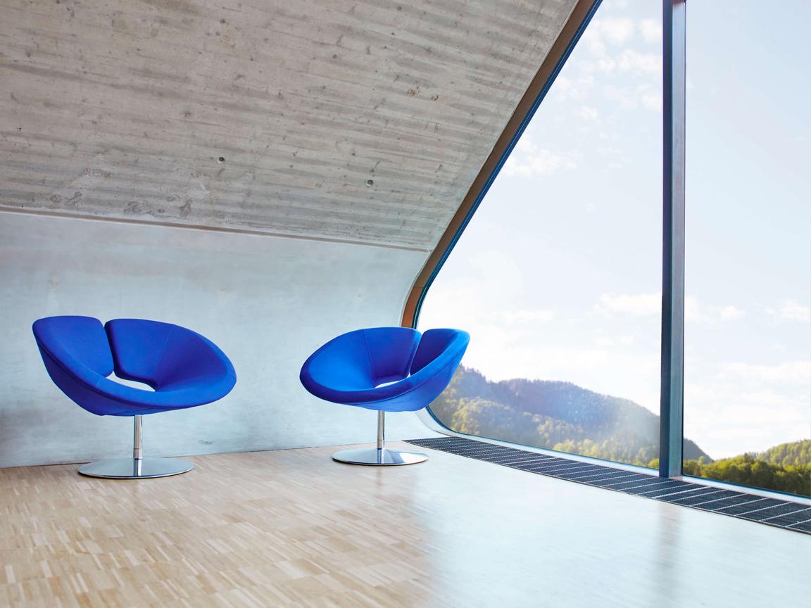 Bright interior with two blue chairs