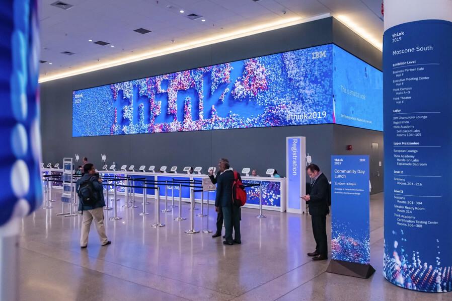 Registry area with IBM Think displays and signage