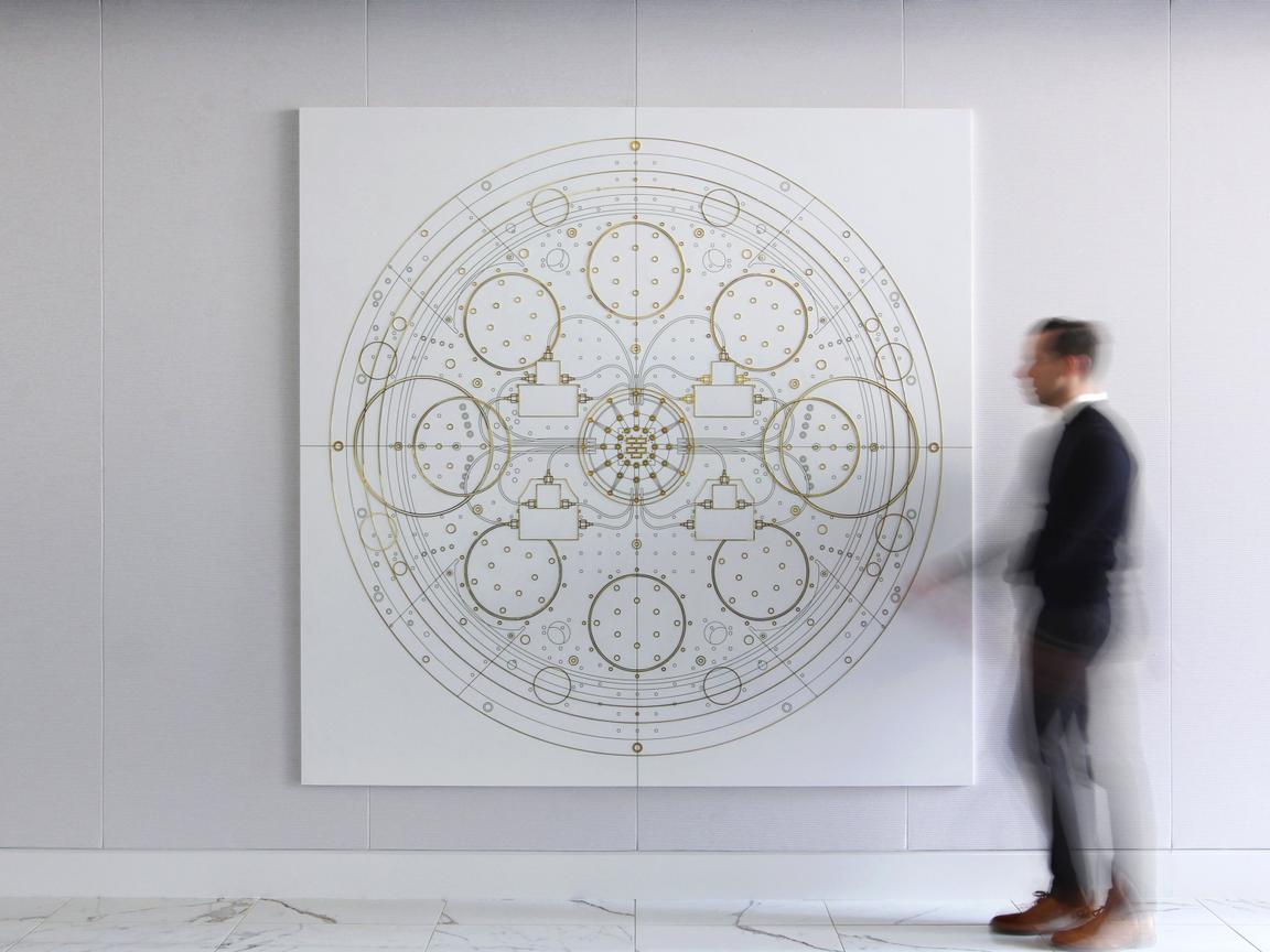 IBM Quantum blueprint depicted in brass wall art