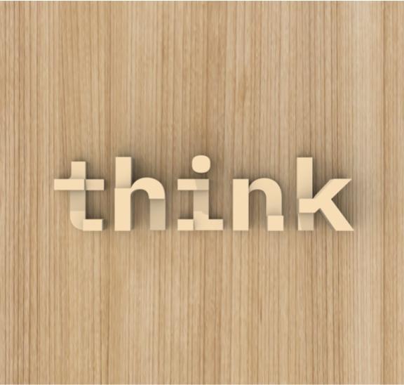 3-D Think® logo sculpture installed on wood wall