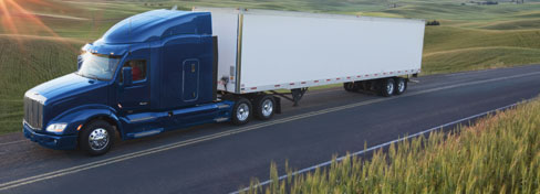 18-wheel truck traveling on two-lane backroad