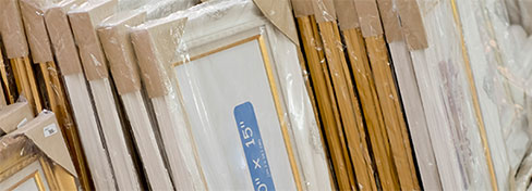 Rows of shrink-wrapped picture frames
