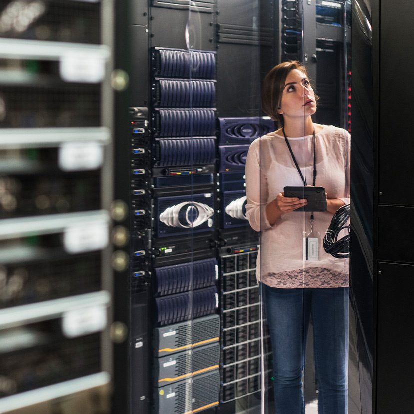 Person using tablet in data center