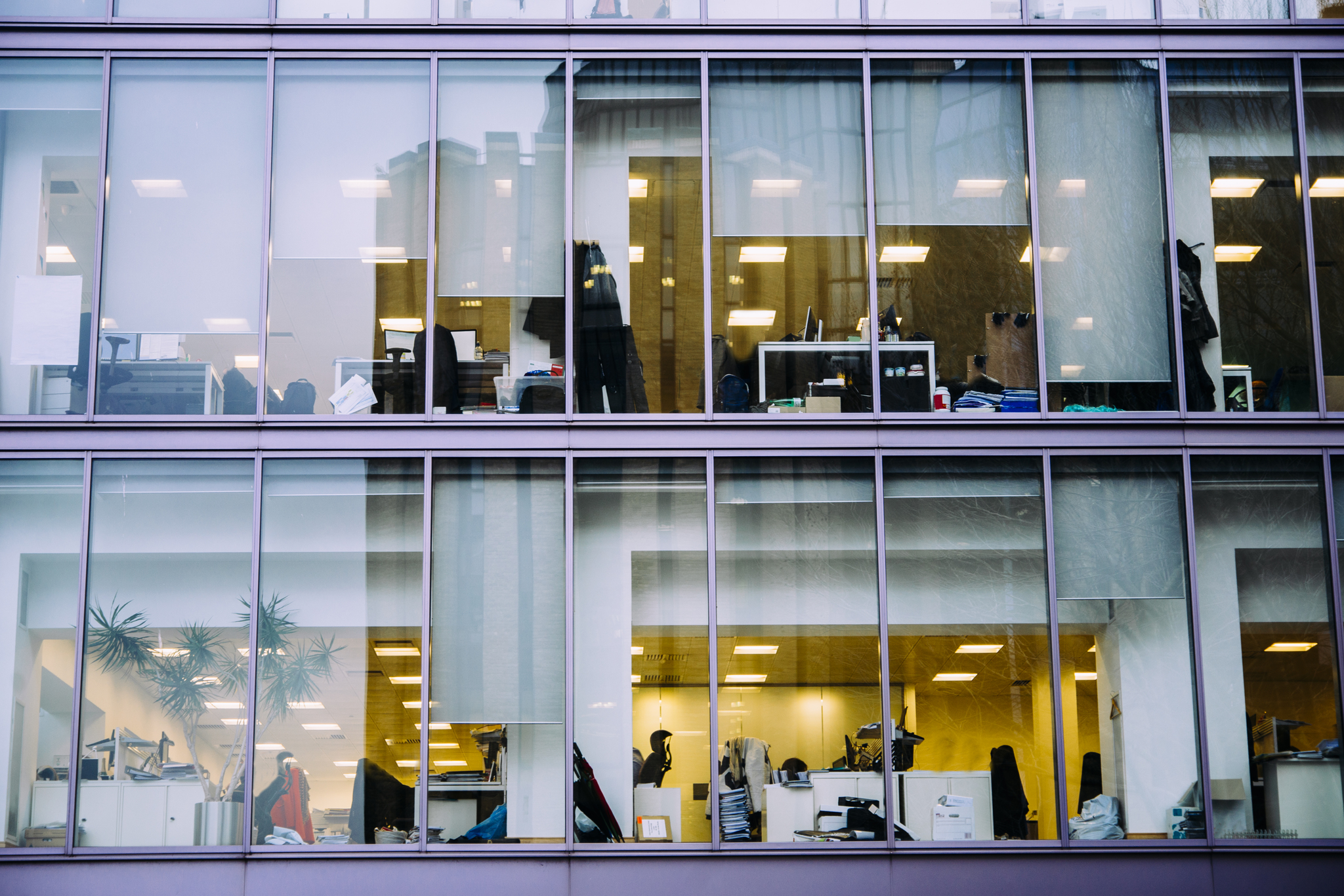 View of office space from outside looking through windows