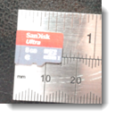 ruler highlighting the tiny size of the microcard